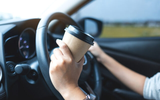 Closeup,Image,Of,A,Woman,Holding,And,Drinking,Coffee,While